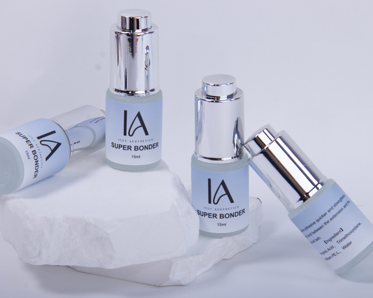 Super Bonder eyelash bottles on a white background